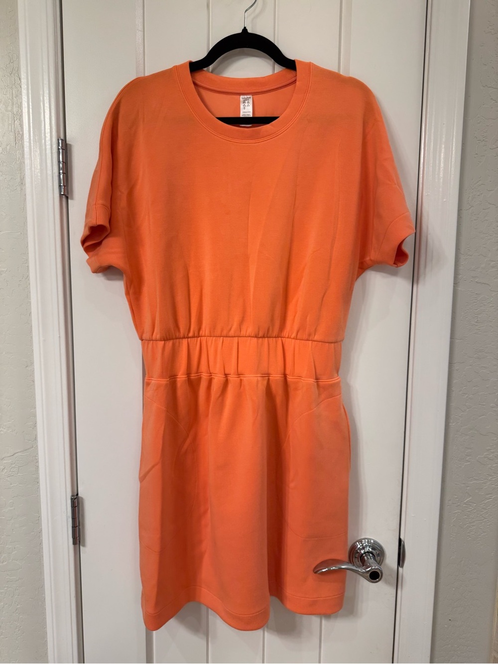 SPANX Air essentials Coral Orange Crewneck Short Sleeve dress with pockets.
